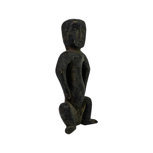 153 - An African carved tribal wood squatting figure. Height 15.5cm, together with a gilt metal figure of ... 