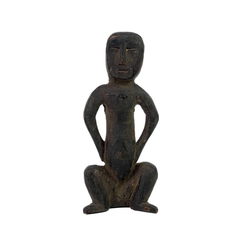 153 - An African carved tribal wood squatting figure. Height 15.5cm, together with a gilt metal figure of ... 