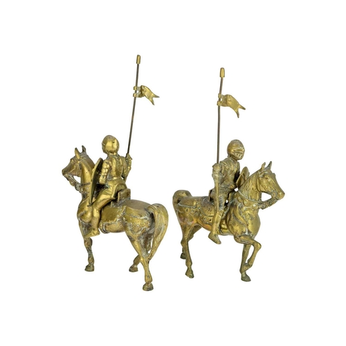 155 - A pair of brass knights on horseback. Height 32cm.