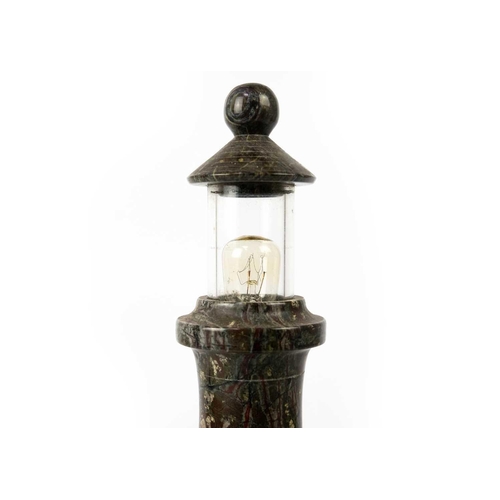 158 - A Cornish serpentine turned lighthouse table lamp. With a glazed top and rockwork base, height 31cm.... 