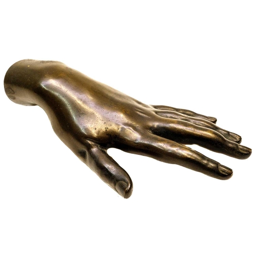 165 - A Victorian hollow bronze model of a hand. Length 20.5cm.