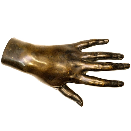 165 - A Victorian hollow bronze model of a hand. Length 20.5cm.