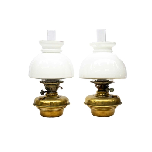 166 - A pair of late Victorian Aesthetic movement cast iron and brass oil wall lights. With hinged brass m... 