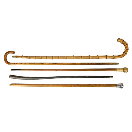 176 - A silver topped malacca walking cane. Length 89.5cm, together with four others, including a horn han... 