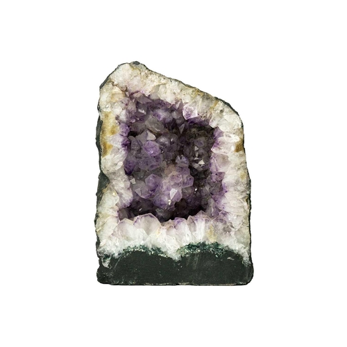 179 - A free standing amethyst 'cathedral' geode. With a flat base, prepared outer surface and large cryst... 