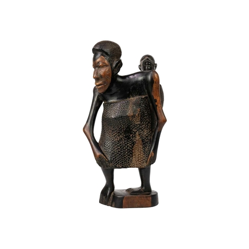 184 - An African hardwood carving group. Of a mother with child, height 25cm Maurice Jenkins (1933-2022). ... 