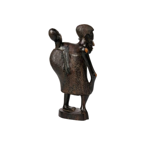 184 - An African hardwood carving group. Of a mother with child, height 25cm Maurice Jenkins (1933-2022). ... 