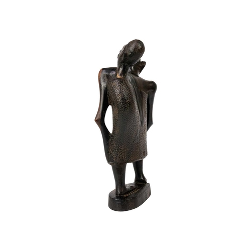 184 - An African hardwood carving group. Of a mother with child, height 25cm Maurice Jenkins (1933-2022). ... 