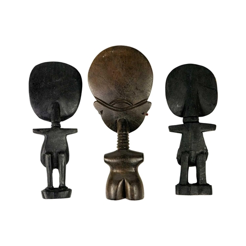 190 - An Ashanti akua'ba fertility doll. Ghana, height 23cm together with two other fertility dolls. (3) M... 