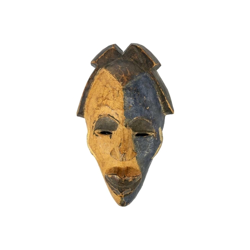 193 - An African wood carved mask. With ochre and blue pigment, length 35.5cm. Maurice Jenkins (1933-2022)... 