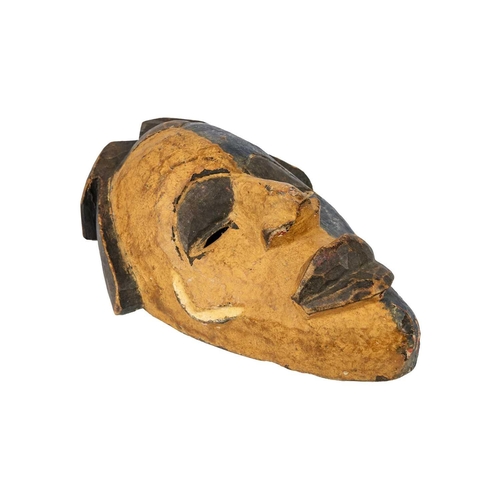 193 - An African wood carved mask. With ochre and blue pigment, length 35.5cm. Maurice Jenkins (1933-2022)... 