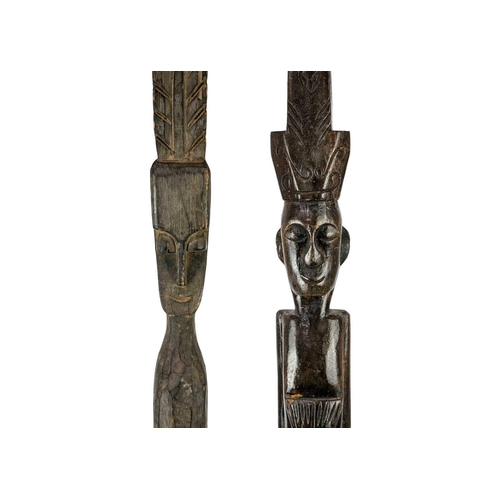 200 - A tall ethnographical wood carved fertility figure. Height 97cm together with another tall wood carv... 