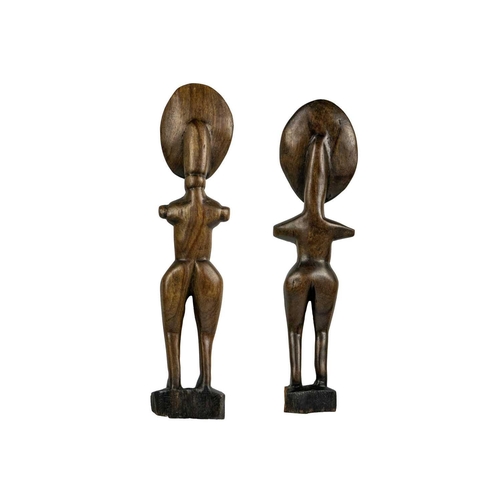 202 - An Ashanti akua'ba fertility doll. Ghana, height 37cm together with another similarly carved example... 