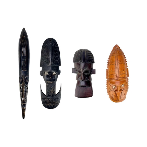 206 - Four Oceania carved masks. Two with inlaid cowrie shells, largest 61cm. (4) Maurice Jenkins (1933-20... 