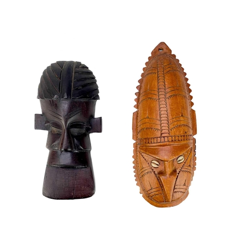 206 - Four Oceania carved masks. Two with inlaid cowrie shells, largest 61cm. (4) Maurice Jenkins (1933-20... 