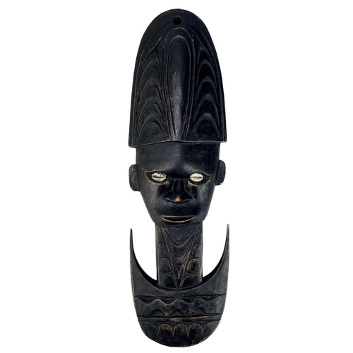 206 - Four Oceania carved masks. Two with inlaid cowrie shells, largest 61cm. (4) Maurice Jenkins (1933-20... 