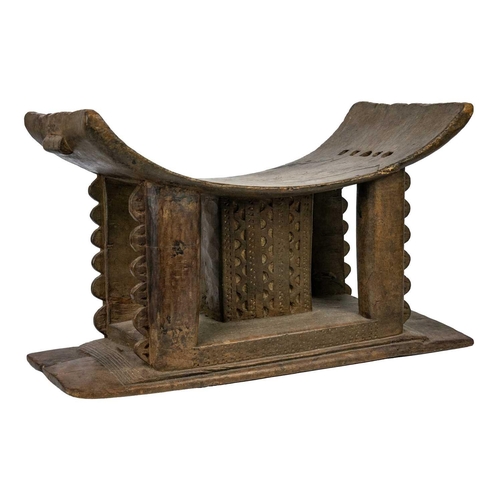 212 - A 19th century Ashanti stool. Of typical form, height 33cm width 53cm depth 27.5cm. Maurice Jenkins ... 