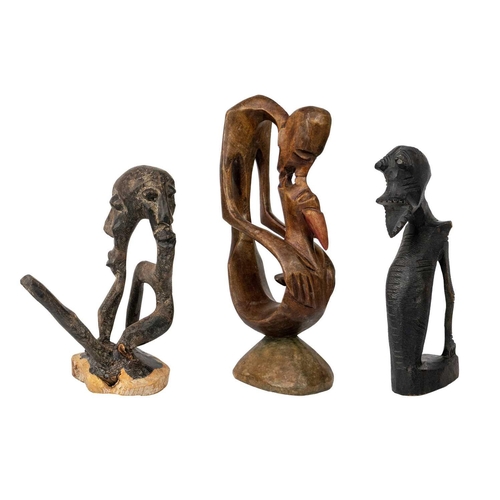 213 - An African carved abstract figure. Height 28cm together with two other carved figures. (3) Maurice J... 