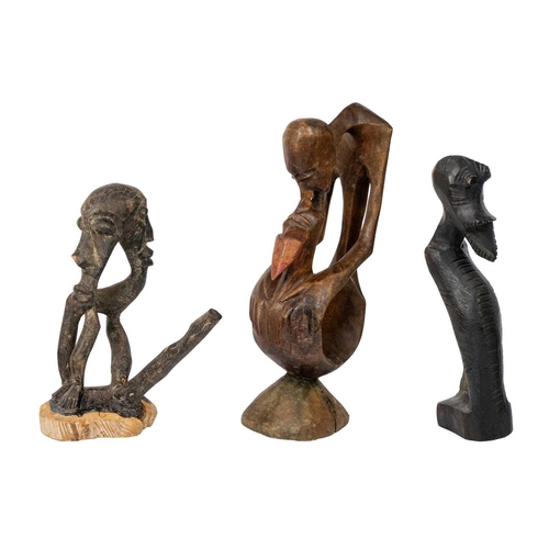 213 - An African carved abstract figure. Height 28cm together with two other carved figures. (3) Maurice J... 