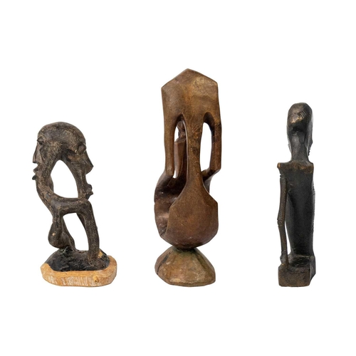 213 - An African carved abstract figure. Height 28cm together with two other carved figures. (3) Maurice J... 