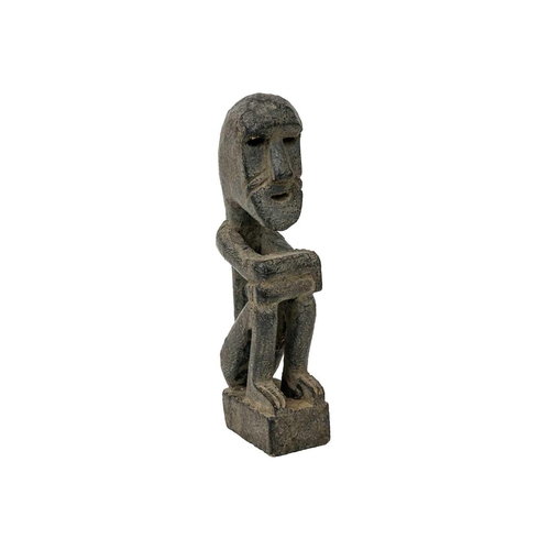 214 - A wood carved ancestor figure. Arms folded sat on their haunches, height 20.5cm. Maurice Jenkins (19... 