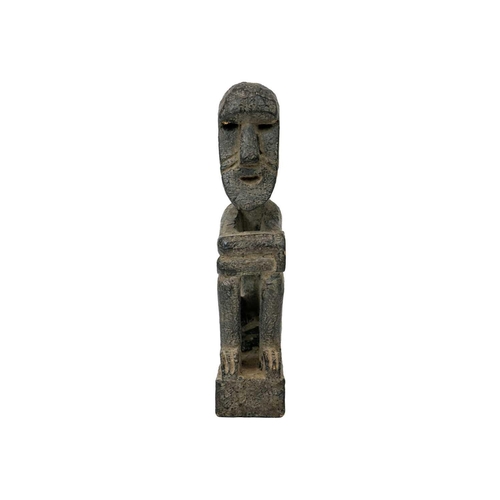 214 - A wood carved ancestor figure. Arms folded sat on their haunches, height 20.5cm. Maurice Jenkins (19... 