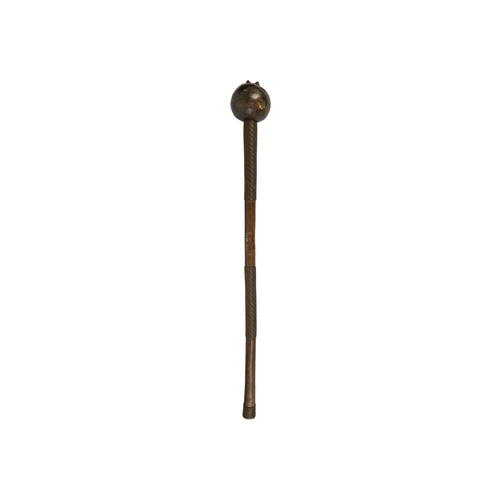 222 - A Zulu knobkerrie. With brass studs, copper and brass bound handle, length 70cm. Maurice Jenkins (19... 