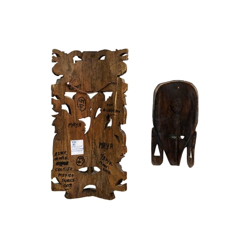 227 - An Aztec style carved wood mask. Carved with a stepped pyramid above figures, length 45cm together w... 