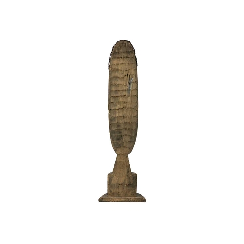 228 - An African wood carved tall bust. With applied fibre coiffure, height 68cm.