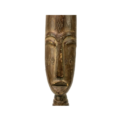 228 - An African wood carved tall bust. With applied fibre coiffure, height 68cm.