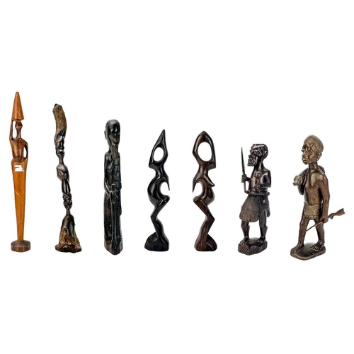 236 - An African hardwood carved figure of a hunter. Height 29cm together with a collection of six other h... 