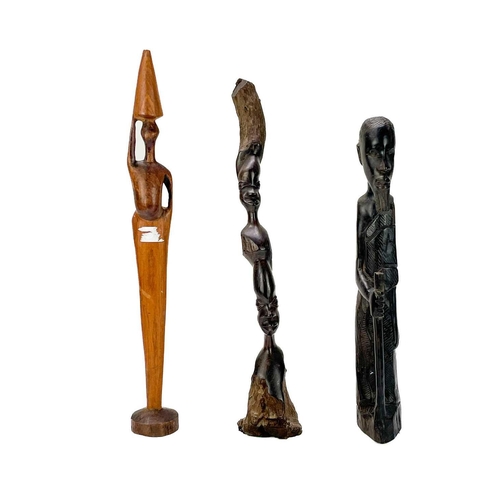 236 - An African hardwood carved figure of a hunter. Height 29cm together with a collection of six other h... 