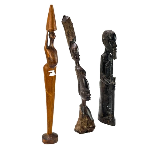 236 - An African hardwood carved figure of a hunter. Height 29cm together with a collection of six other h... 