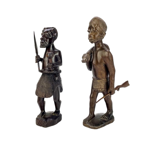 236 - An African hardwood carved figure of a hunter. Height 29cm together with a collection of six other h... 