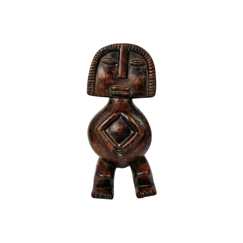 238 - An African wood carved figure. Possibly Fang, height 31cm.