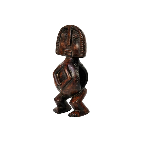 238 - An African wood carved figure. Possibly Fang, height 31cm.