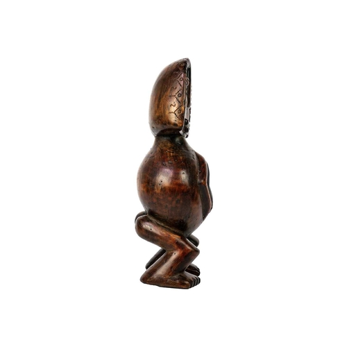 238 - An African wood carved figure. Possibly Fang, height 31cm.