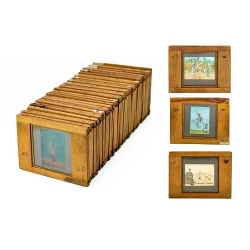 24 - A collection of 33 magic lantern slides. Depicting the History of the bicycle with a laminated list ... 