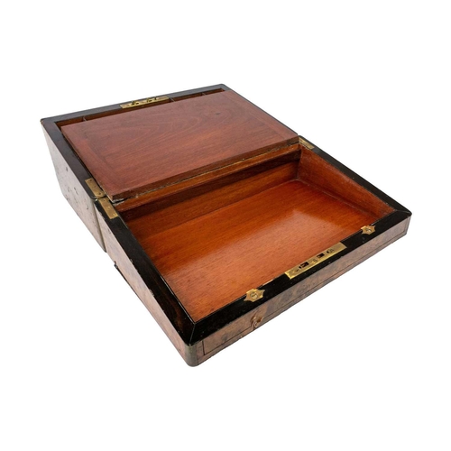 257 - A Victorian burr walnut and brass bound writing slope. The fitted interior with leather skiver and t... 