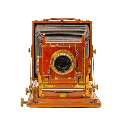 259 - A Thornton Pickard Triple Victo mahogany folding plate camera. With a Busch's rapid symmetrical F:8 ... 