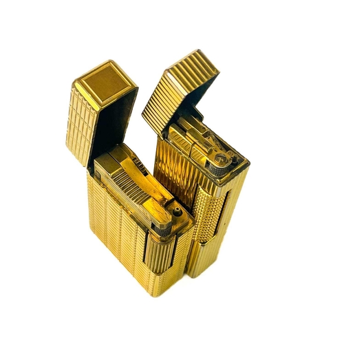 262 - A Dunhill gold plated pocket lighter. Height 6.4cm, together with a DuPont lighter, serial number EK... 