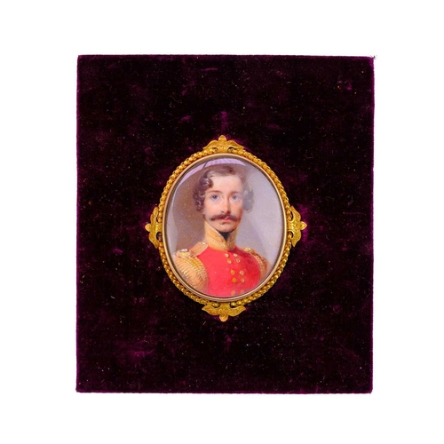 266 - English school, early 19th century. An oval portrait miniature of an officer, in an ornate gold fram... 