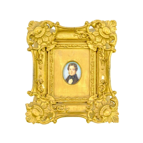 267 - A group of four 19th century miniature portraits. A lady, wearing a lace-trimmed dress and an ornate... 