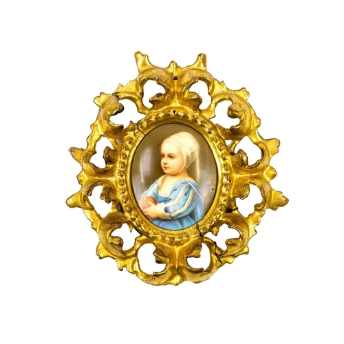 273 - A German oval painted porcelain plaque. With a portrait of Prince James Stuart as a boy, after the o... 