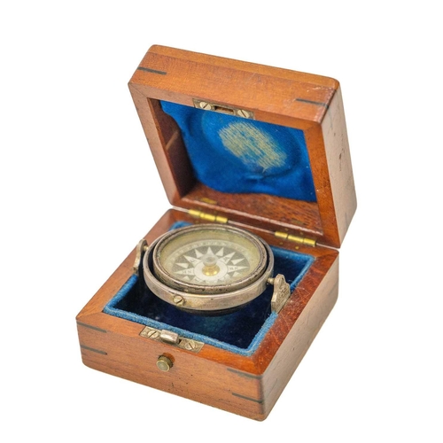 287 - A 19th century Gentleman's travelling gimble mounted pocket compass. Mounted in mahogany case, diame... 