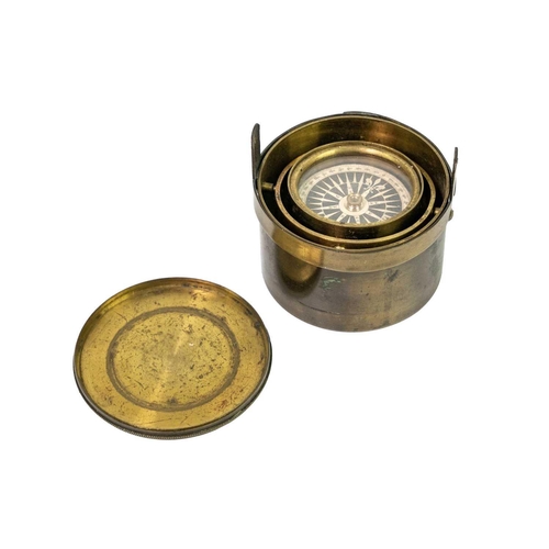 298 - A 19th century brass gimbal mounted pocket compass. Compass diameter 4.5cm. General wear commensurat... 