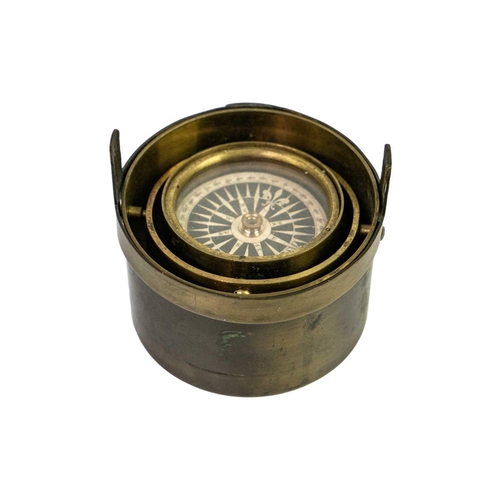 298 - A 19th century brass gimbal mounted pocket compass. Compass diameter 4.5cm. General wear commensurat... 