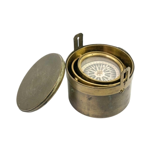 298 - A 19th century brass gimbal mounted pocket compass. Compass diameter 4.5cm. General wear commensurat... 