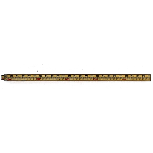 299 - A mahogany and brass bound telescopic surveyor's staff. With original painted scale, height (retract... 