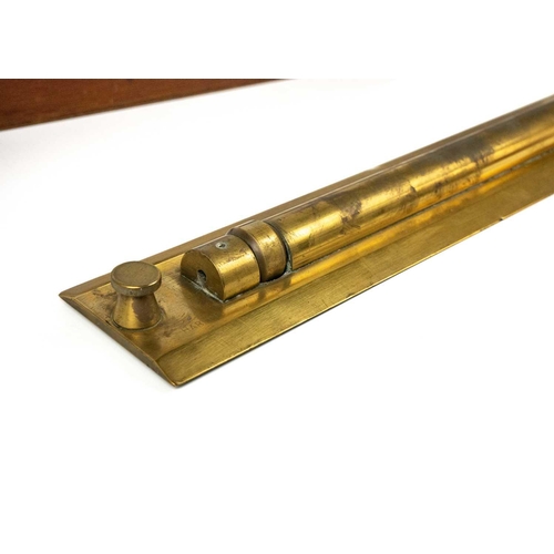 304 - A military brass parallel rolling rule. Stamped Pat No 160100, length 46cm, in stained wood case.